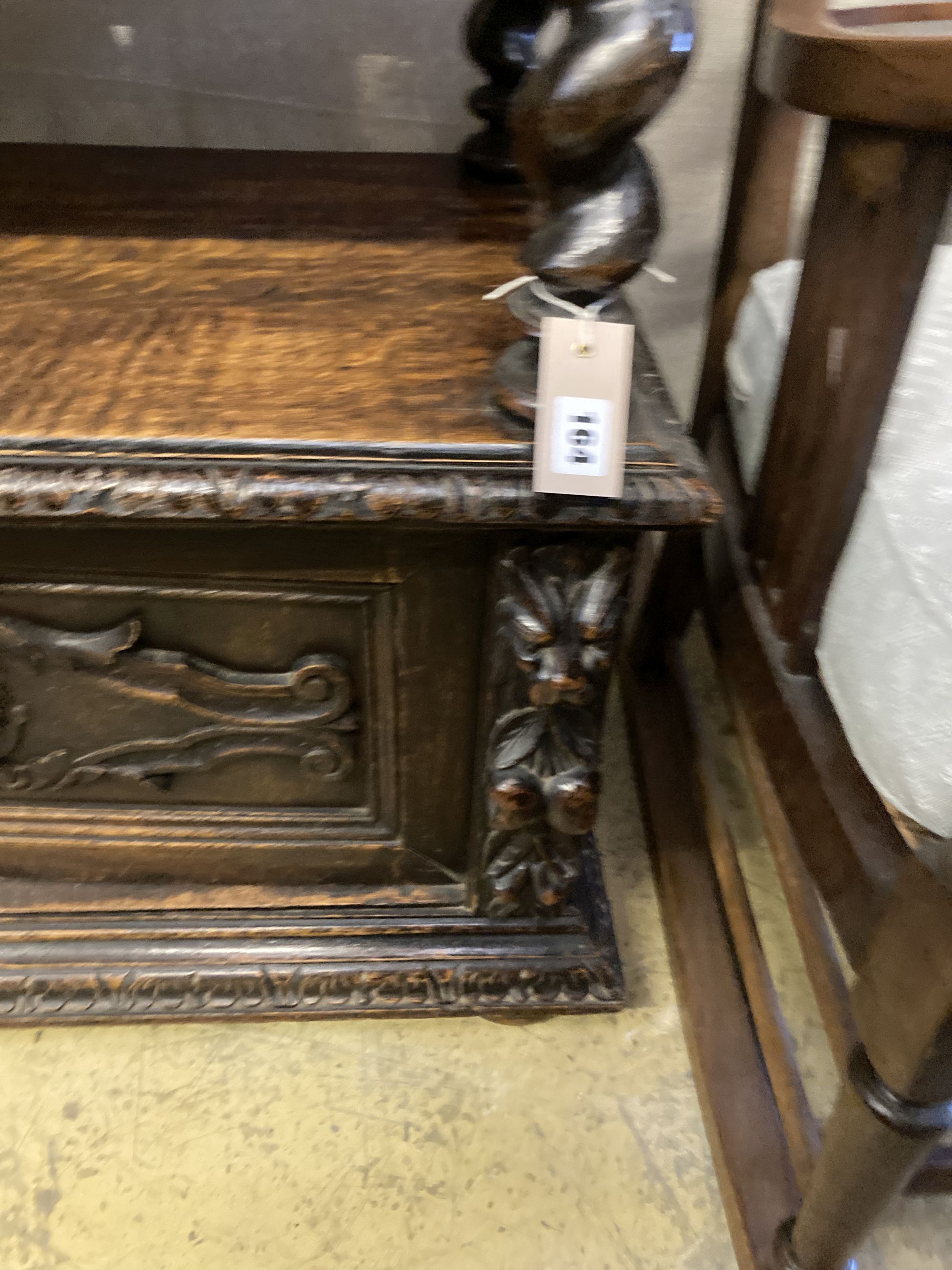 A late 19th century Flemish carved oak buffet, width 136cm, depth 40cm, height 94cm